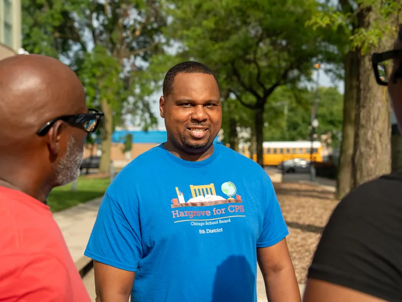 Anthony Hargrove facing the camera among a small group outdoors.