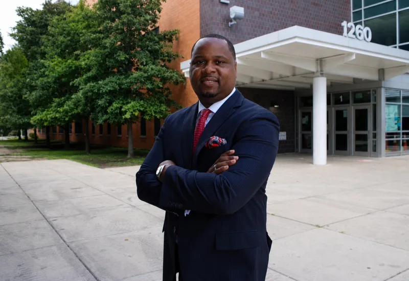 Anthony Hargrove standing with folded arms outside Mark T. Skinner West Elementary School.